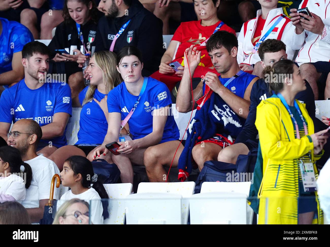 Great Britain's Tom Daley knitting as he watches the Women's ...