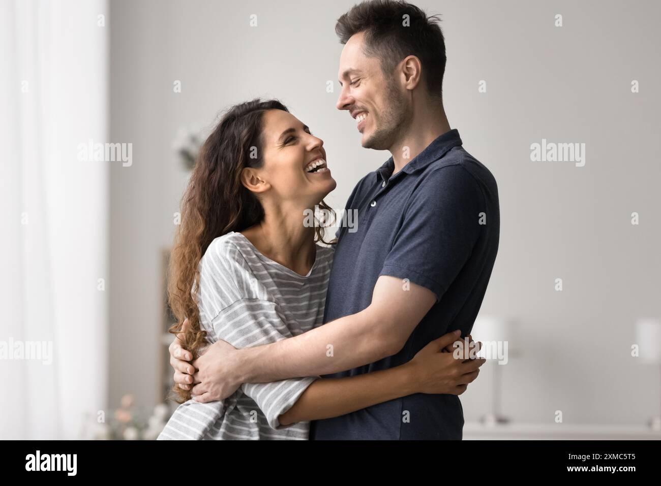 Loving woman hugging beloved hi-res stock photography and images - Alamy