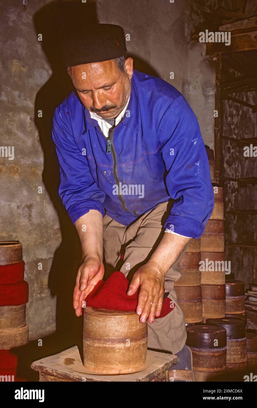 Tunisian Hat, Chechia.  Fitting the Hat to the Block for Shaping and Sizing. Stock Photo