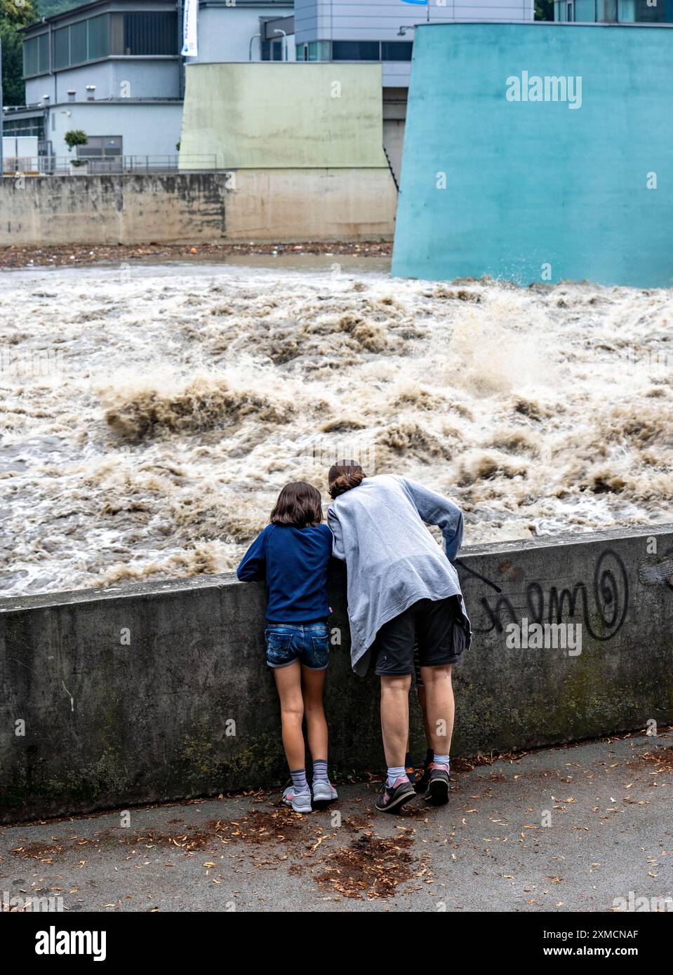 Weir of the Lake Baldeney in Essen, the masses of water roar through the open weirs, spectators, onlookers, high water on the Ruhr, after long heavy Stock Photo