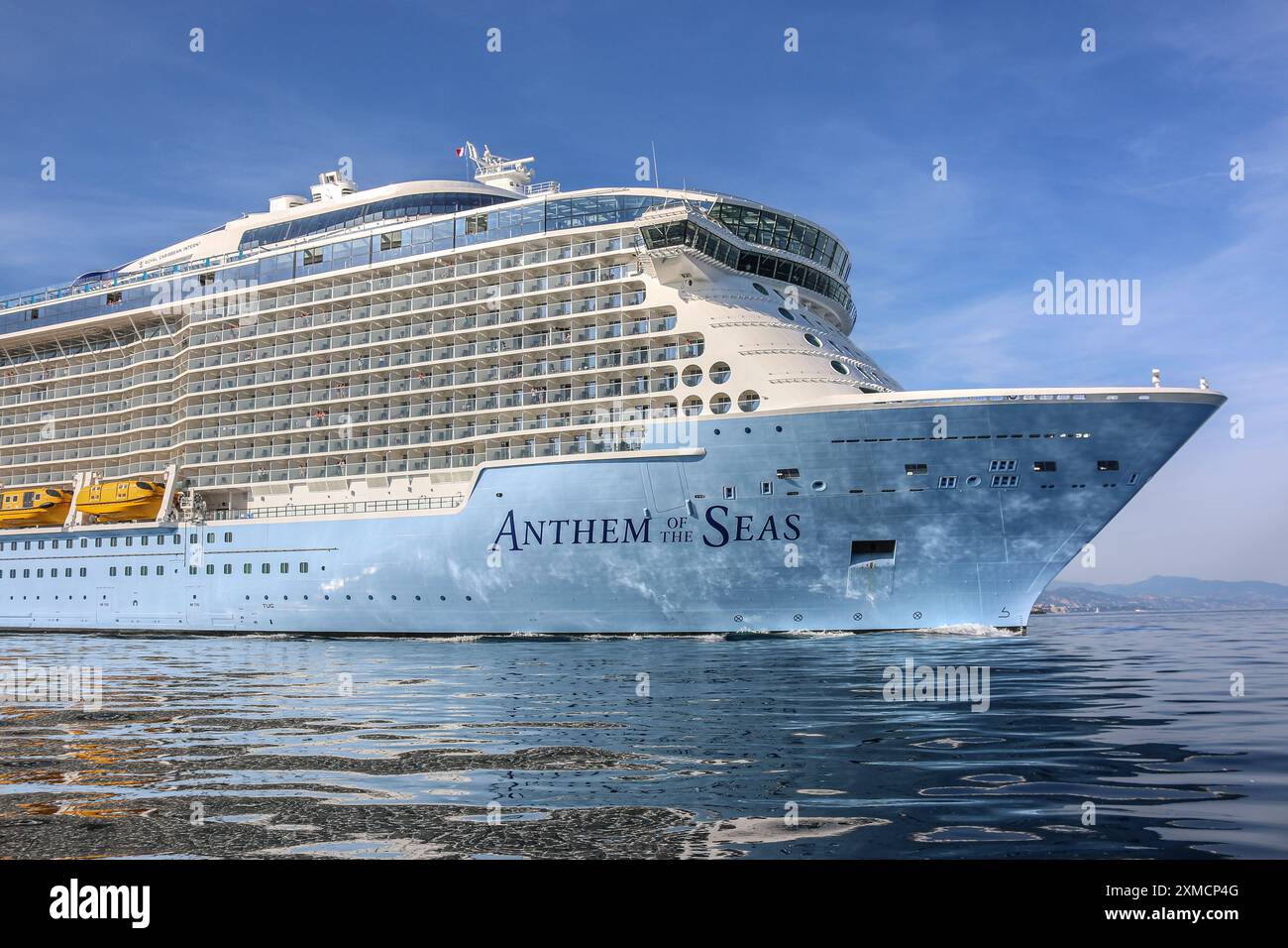 Nice, France : The giant Royal Caribbean's ANTHEM OF THE SEAS in navigation seen from pilot boat in Villefranche sur Mer. A unique stopover for the largest cruise ship this year in the French Riviera's small port. After summer season, the impressive ship was to sail Mediterranean Sea then through Suez Canal as part of a repositioning from Europe to new homeport in Singapore but following Red Sea tensions & Houthi missile attacks threats on ships, she will instead transit without passenger around the southern tip of Africa to reach Dubai & Asia.Credit: Kevin Izorce/Alamy Live News Stock Photo