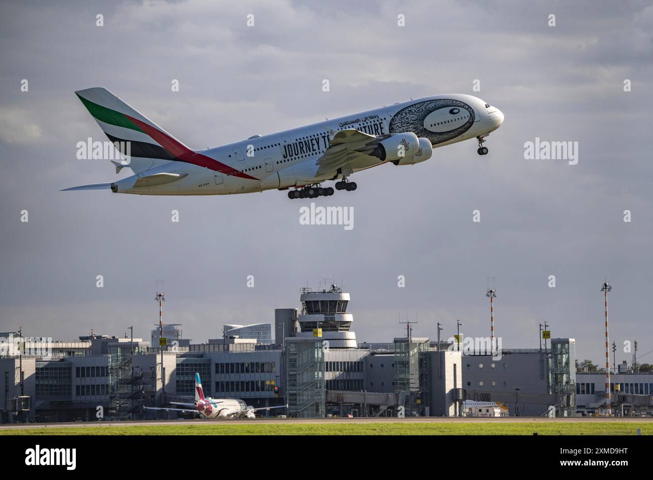 Emirates, Airbus A380-800, A6-EUT, on take-off at Duesseldorf International Airport, air traffic control tower Stock Photo