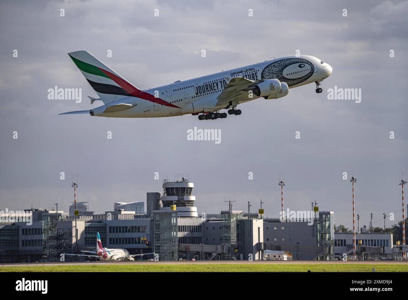 Emirates, Airbus A380-800, A6-EUT, on take-off at Duesseldorf International Airport, air traffic control tower Stock Photo