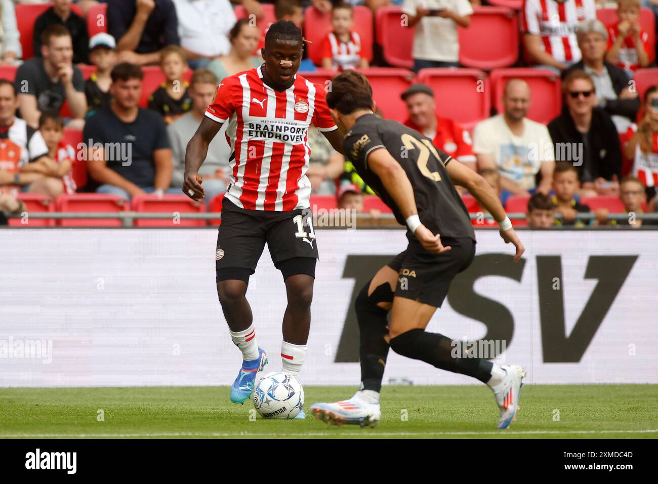 EINDHOVEN, NETHERLANDS - JULY 27: Johan Bakayoko of PSV Eindhoven battles for the ball with Jesus Vazquez of Valencia CF during the Pre season Friendly match between PSV Eindhoven and Valencia CF at Philips Stadion on July 27, 2024 in Eindhoven, Netherlands (Photo by Orange Pictures) (Photo by Orange Pictures/Orange Pictures) Credit: Orange Pics BV/Alamy Live News Stock Photo