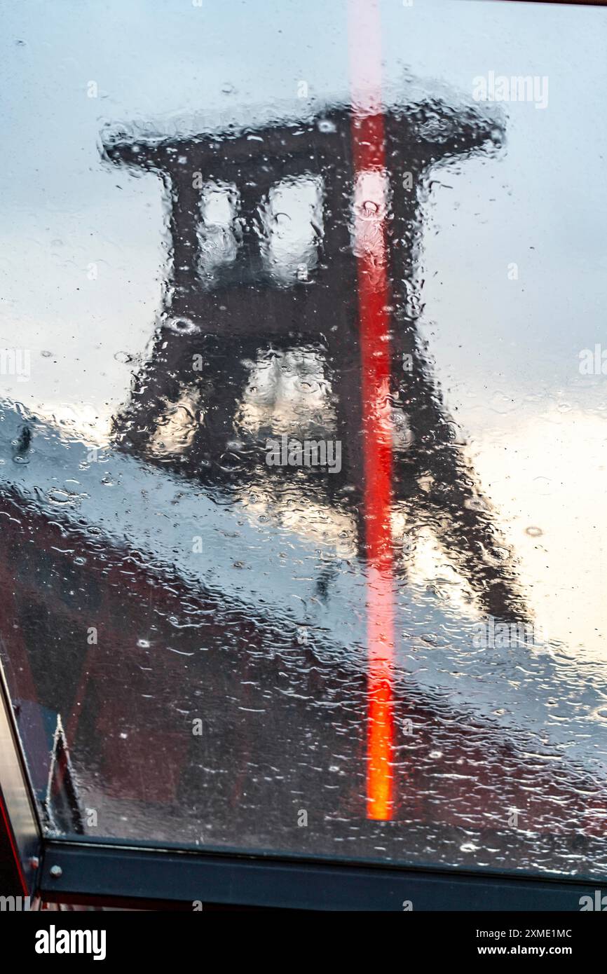 Zeche Zollverein, rainy day, ride on the escalator of the Ruhr Museum, in the coal washing plant, view of the double headframe of shaft XII, through Stock Photo