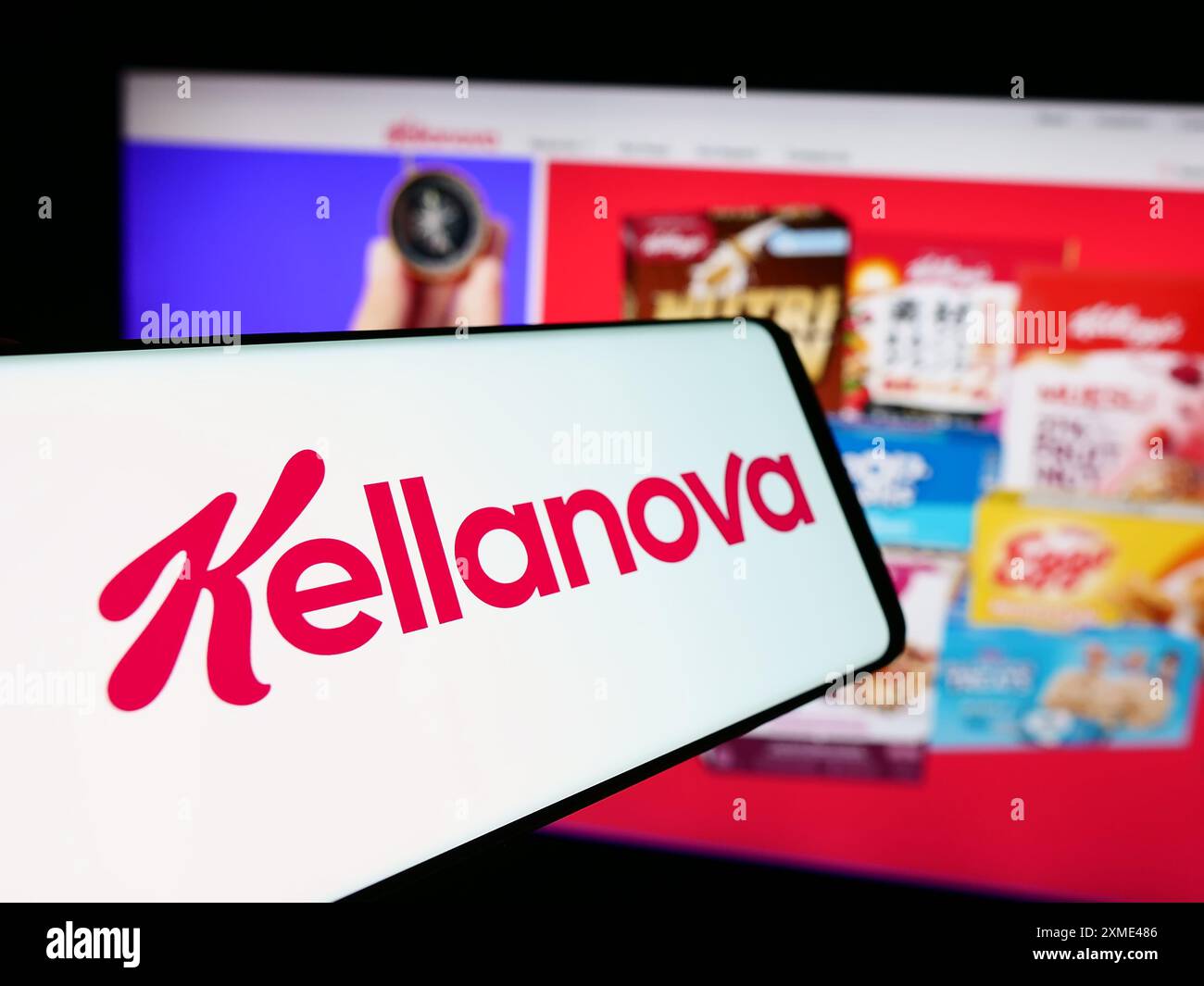 Cellphone with logo of American food processing business Kellanova Company in front of business website. Focus on center-left of phone display. Stock Photo