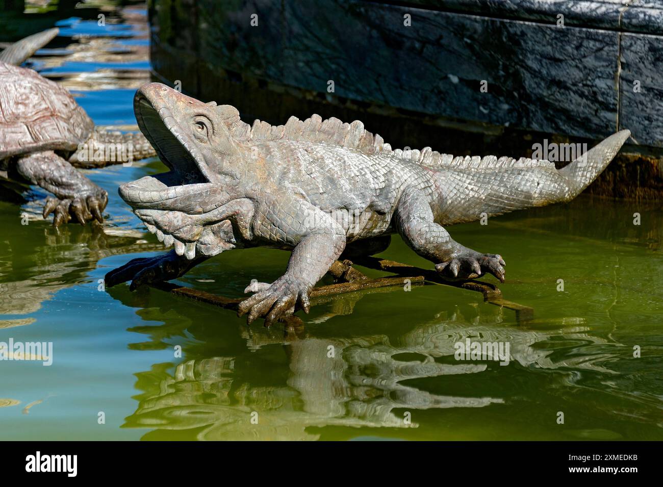 Animal figure of an iguana as a gargoyle, Latona fountain, Latona fountain, fountain, castle park, Herrenchiemsee Castle, Herreninsel, Chiemsee Stock Photo