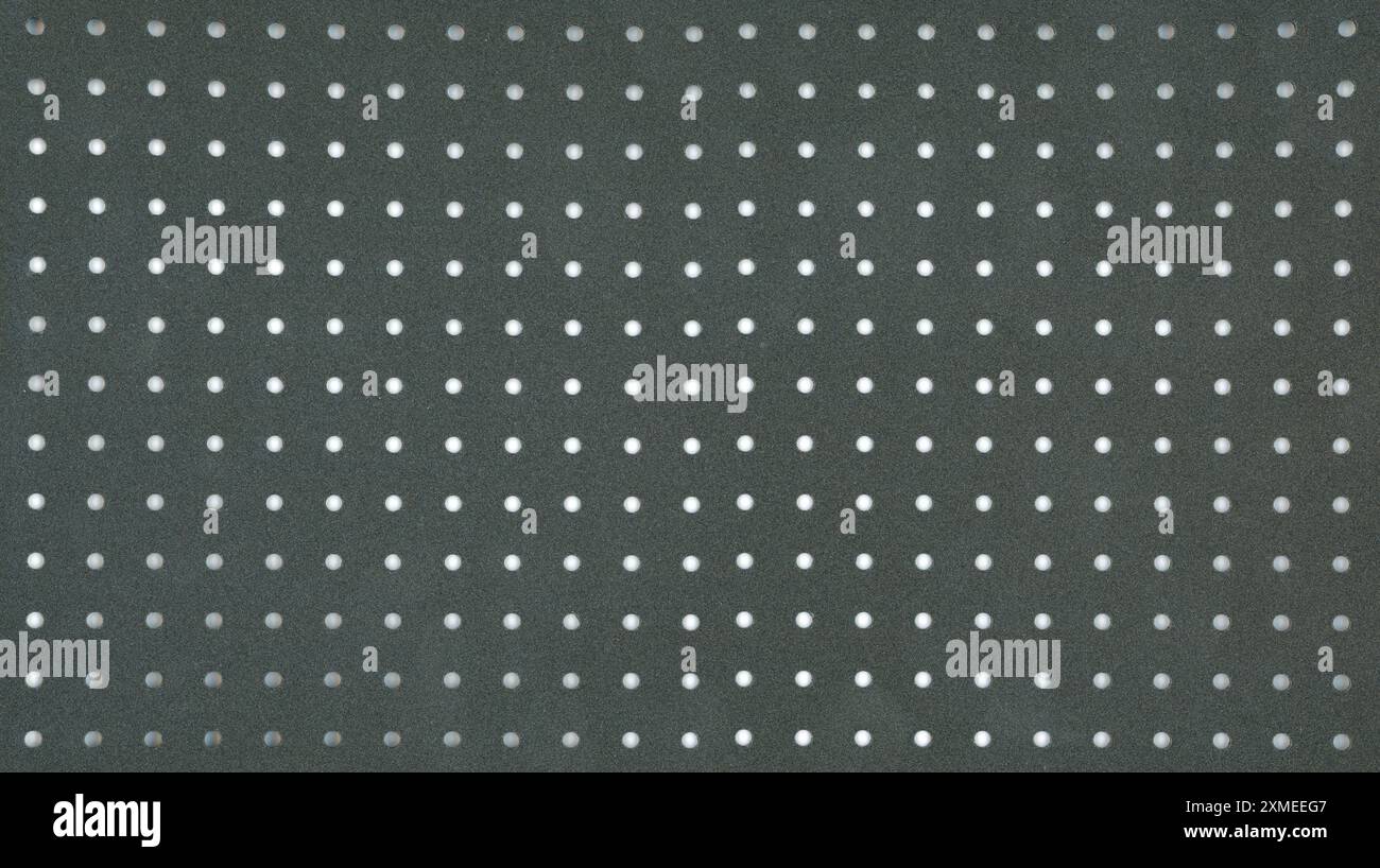 perforated metal sheet plate useful as a background Stock Photo
