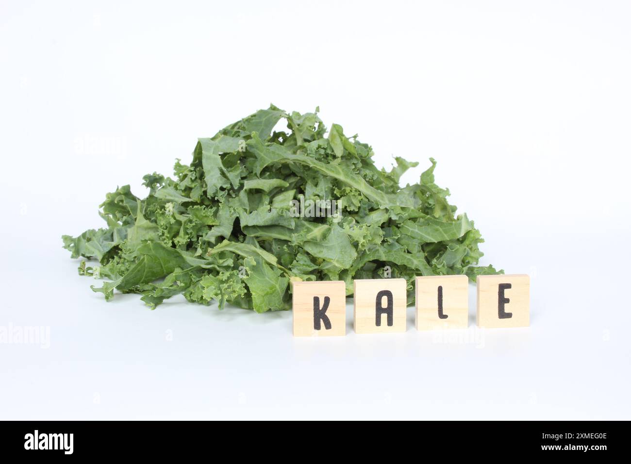 Kale Lette Kale leaves with letter tiles on white background Stock Photo - Alamy