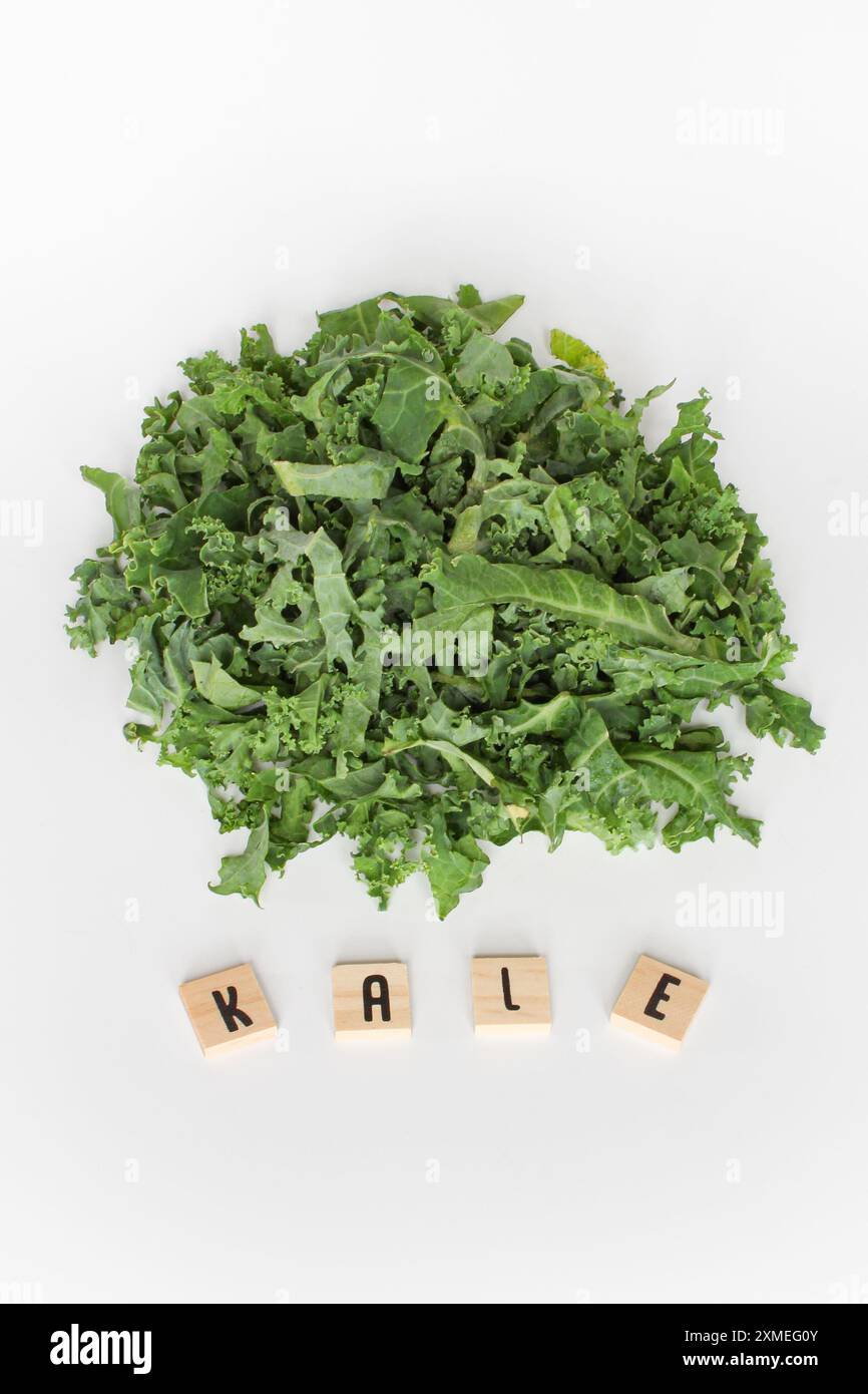 Kale Lette Kale leaves with letter tiles on white background Stock Photo - Alamy