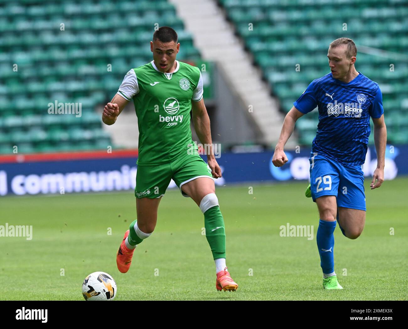 Lewis miller of hibernian with cieran dunne of peterhead hi-res stock ...