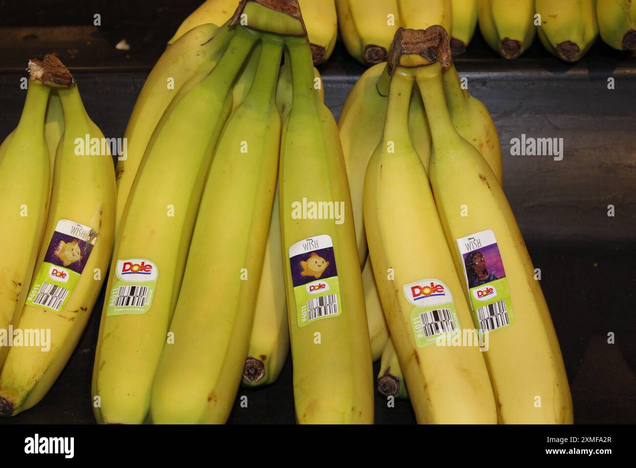 Yellow Dole Bananas closeup on a shelf Stock Photo