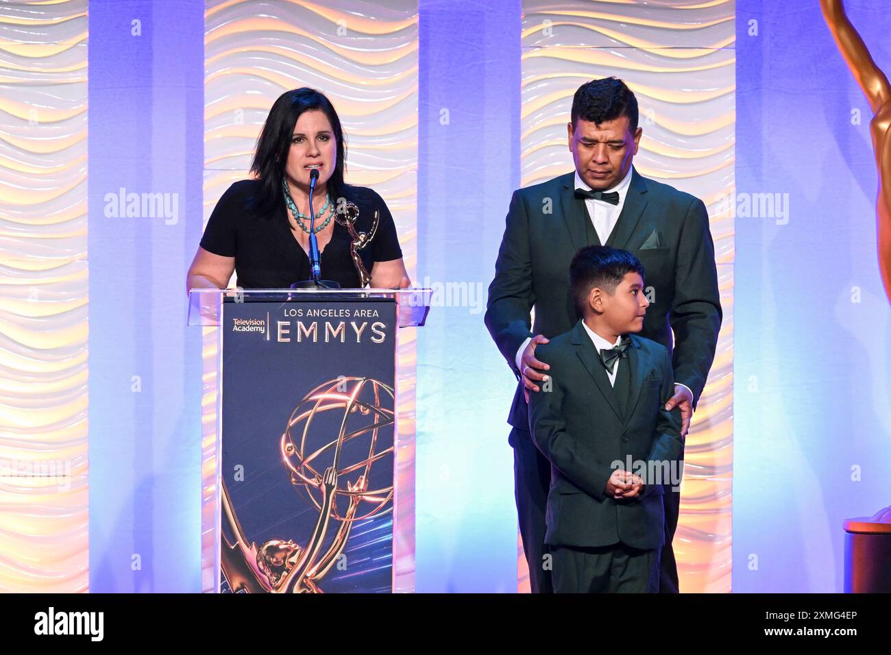 Claudia Cisneros Mendez and Javier Martin Solano accept the Human Interest  News Story Emmy for Tras Los Pasos de Un Migrante at the 76th L.A. Area  Emmy Awards on Saturday, July 27,