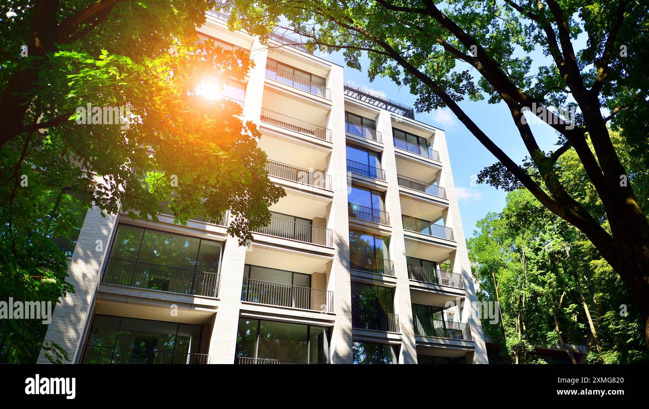 Modern residential building with new apartments in a green residential ...