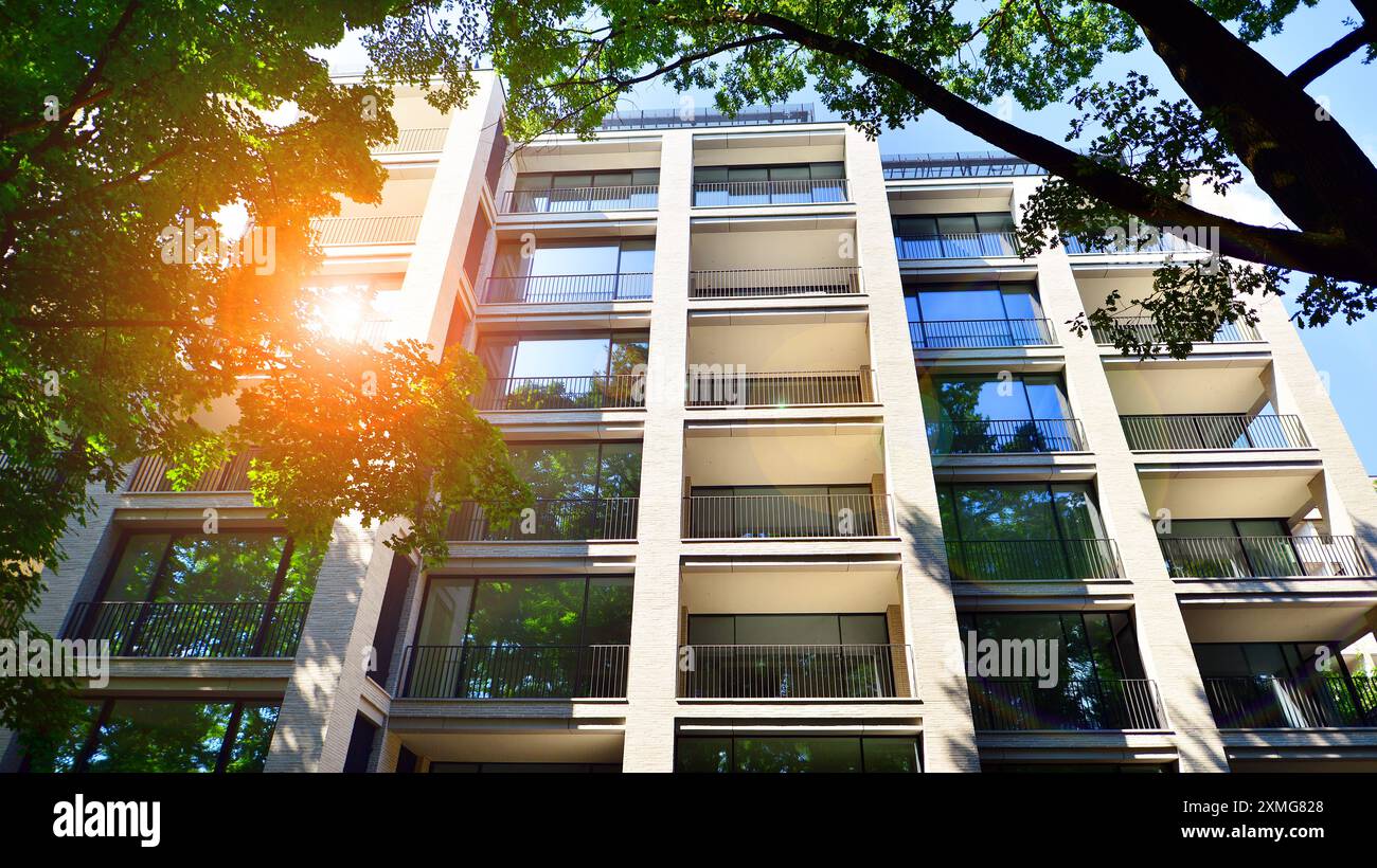 Modern residential building with new apartments in a green residential ...