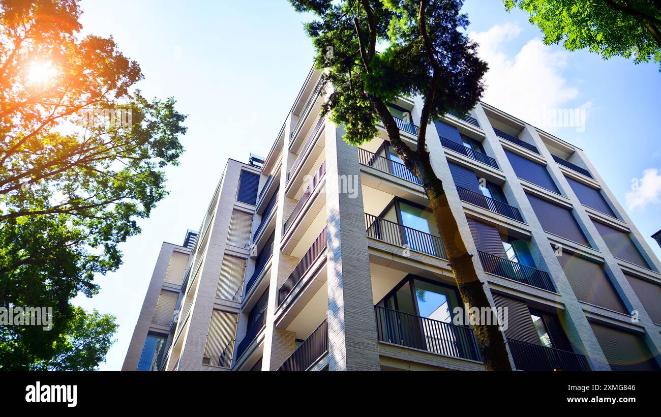 Modern residential building with new apartments in a green residential ...
