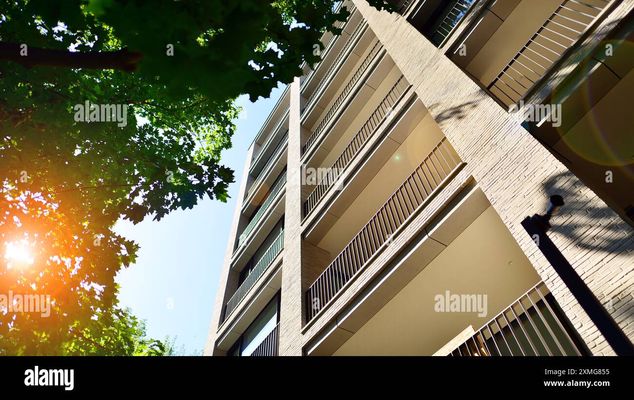 Modern residential building with new apartments in a green residential ... - Green Luxury Apartments For Sale In A Historic Building