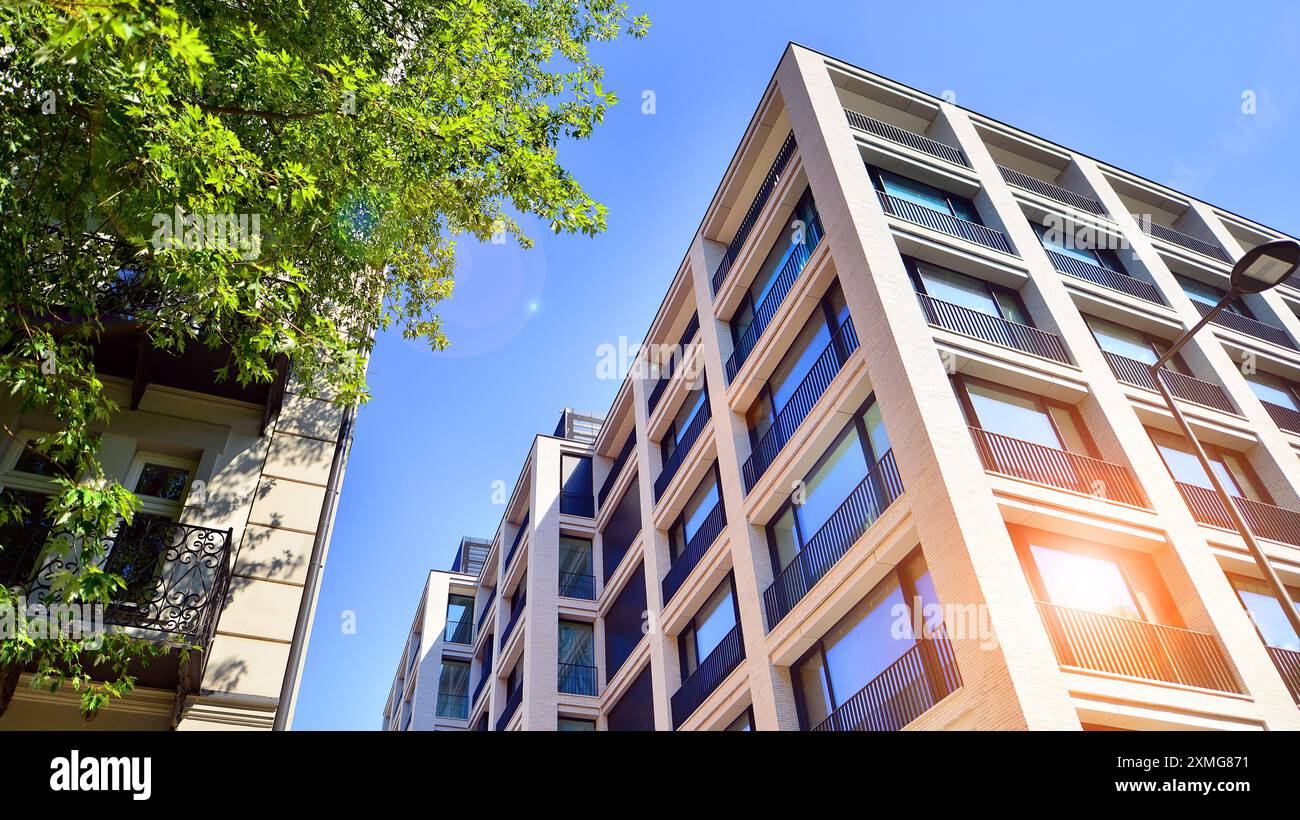 Modern residential building with new apartments in a green residential ...