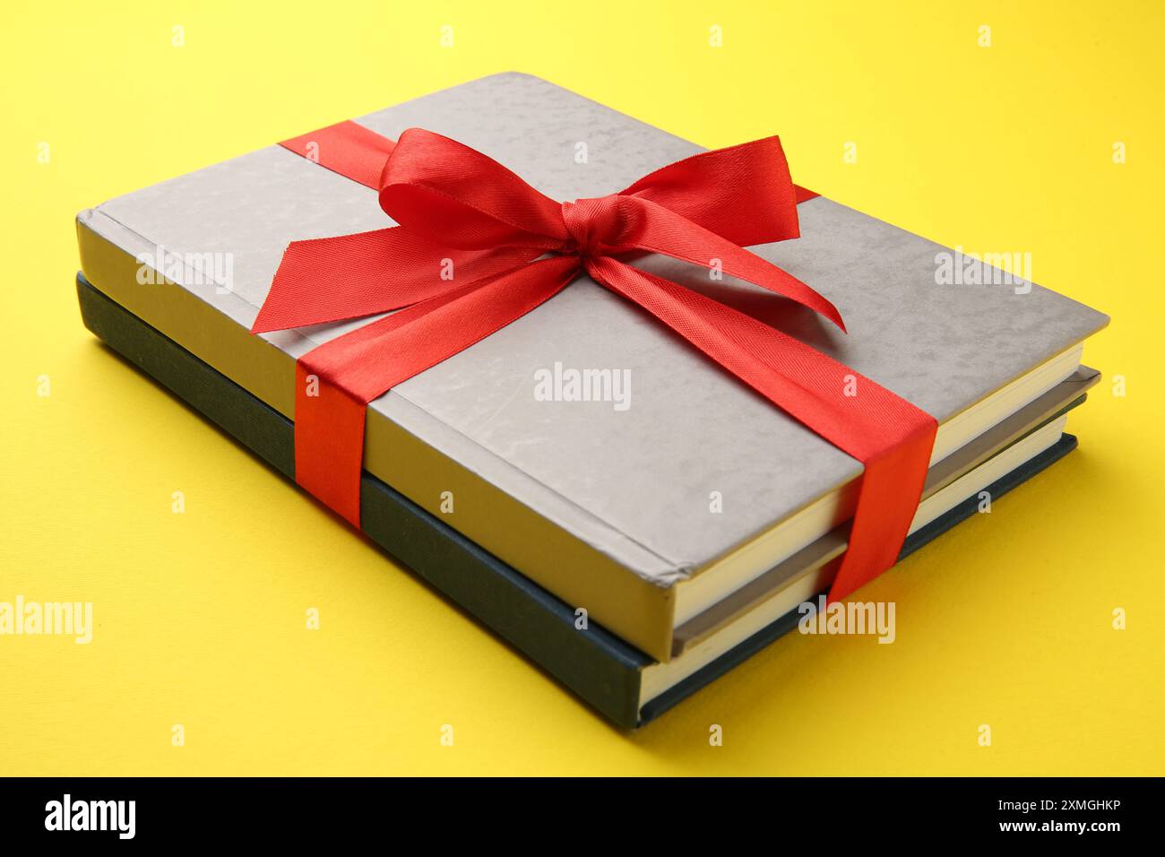 Books tied with ribbon hi-res stock photography and images - Alamy