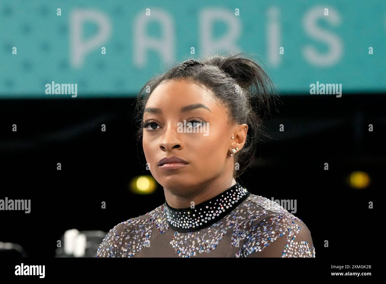 Simone Biles of the United States waits to compete on the balance beam ...