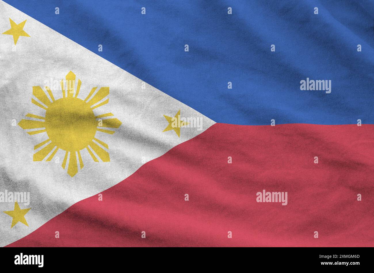 Philippines flag depicted on folded wavy fabric of old cloth close up Stock Photo