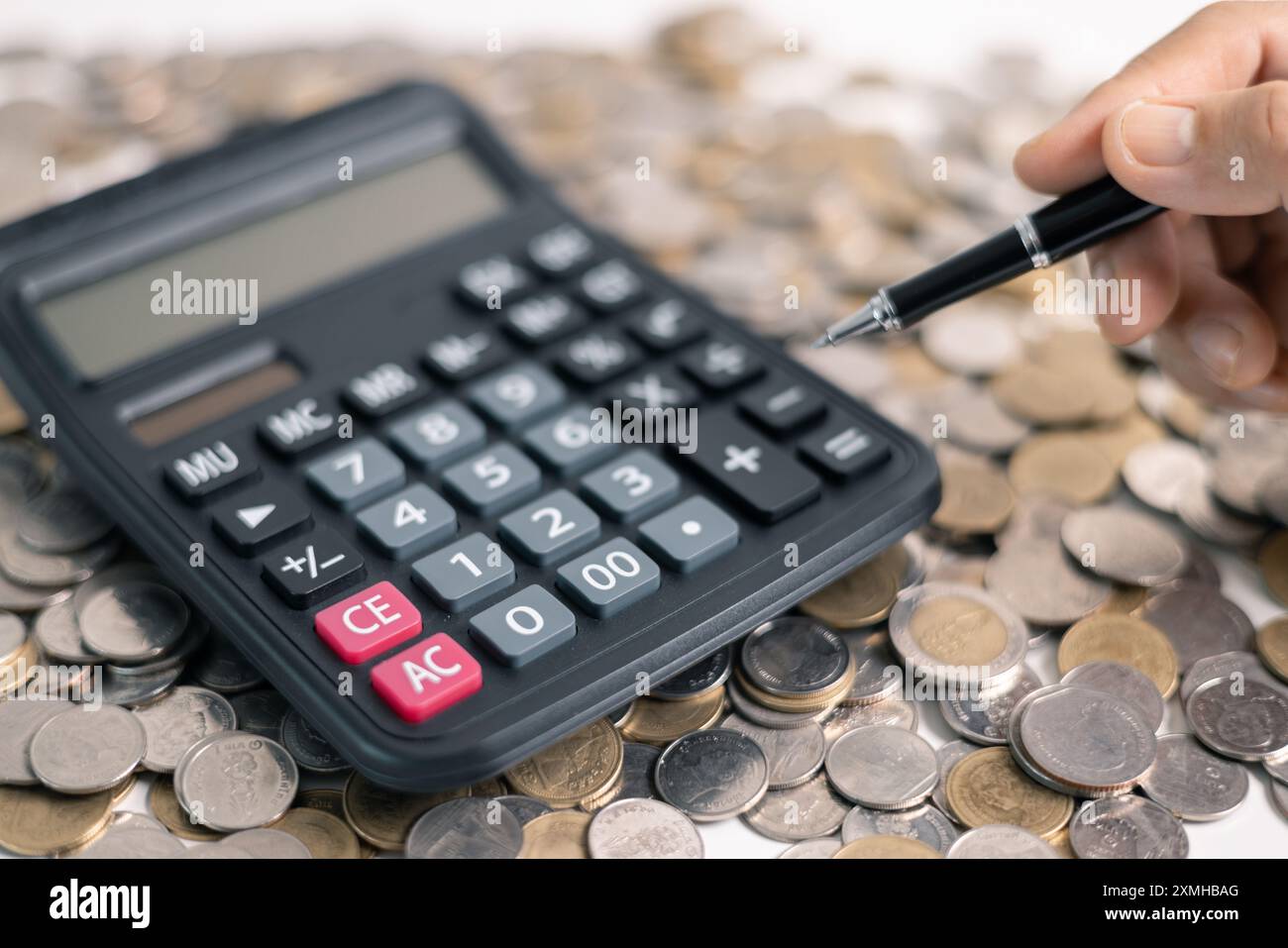 Effective finance management involves strategic investment and saving practices to foster growth in money, with careful accounting of coins and curren Stock Photo
