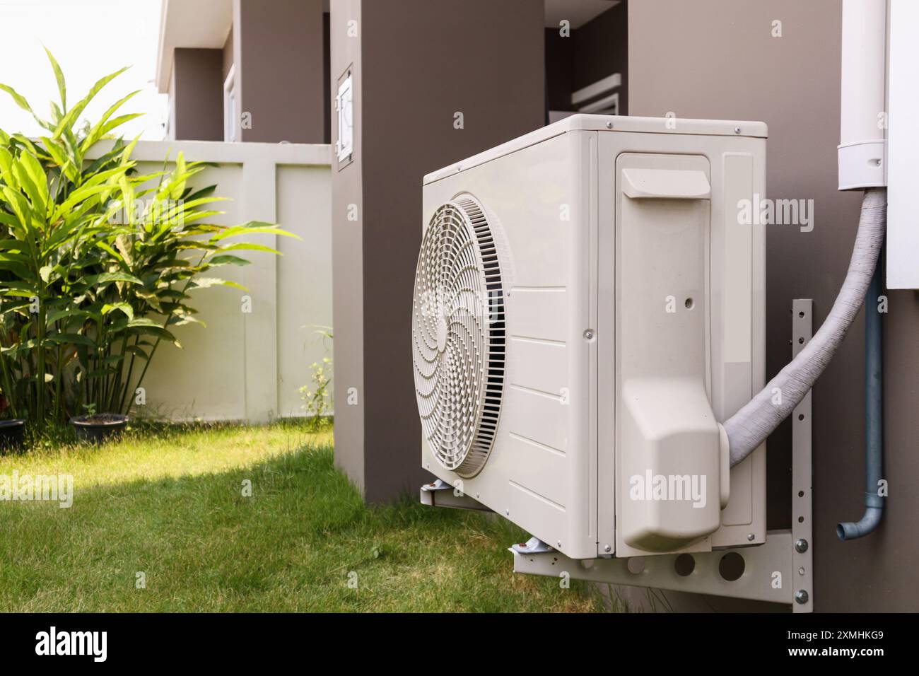 Air conditioner compressor outdoor unit installed outside the house ...