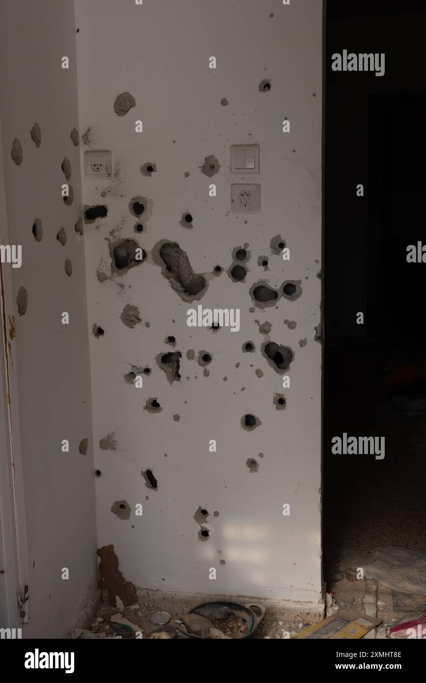 Bullet holes and damage to the interior wall of a home in Kibbutz Kfar Aza, which was attacked by Palestinian terrorists on October 7, 2023. More than Stock Photo