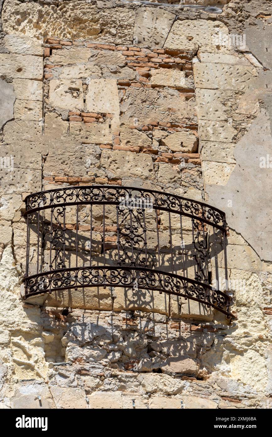 Rustic Balcony on Weathered Stone Wall Stock Photo