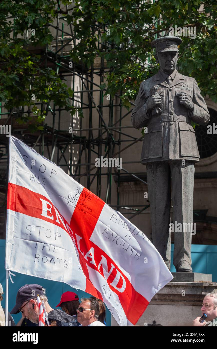 Statue of Hugh Dowding (RAF Battle of Britain) above protesters at ...
