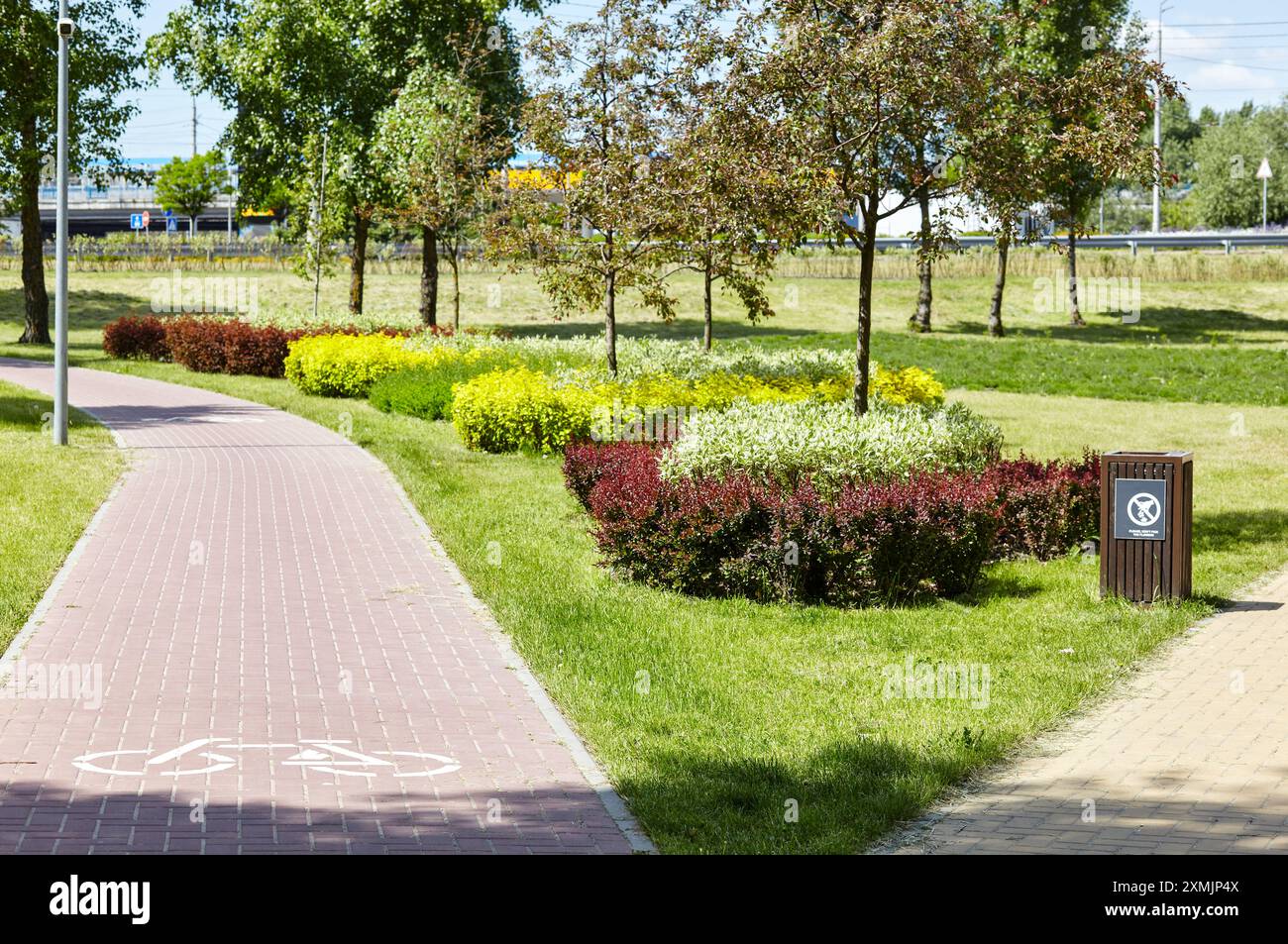 Pathway surrounded by trees and ornamental shrubs in Kyiv, Europe ...