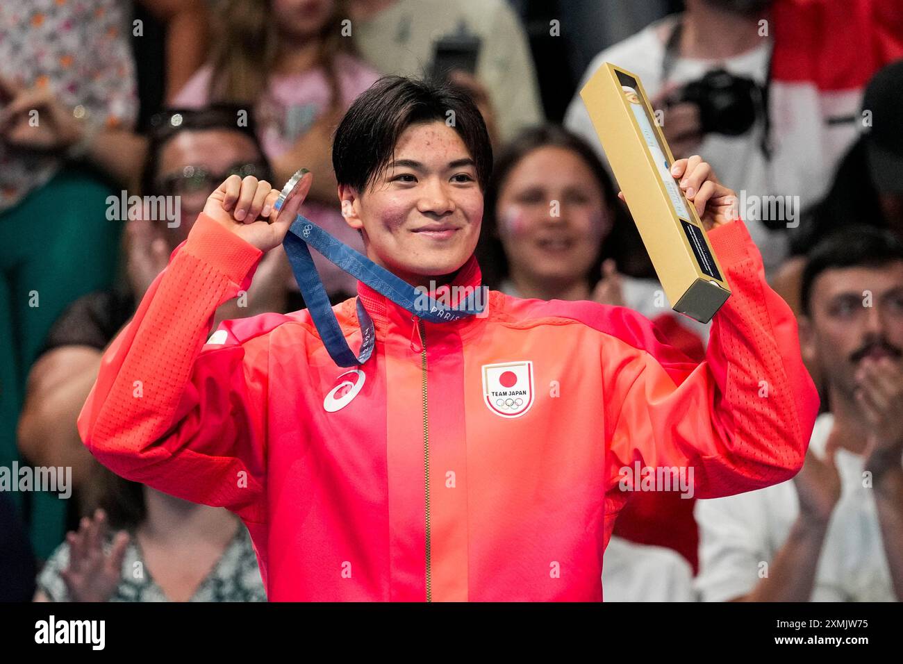 Silver medalist, Tomoyuki Matsushita, of Japan, stands on the podium