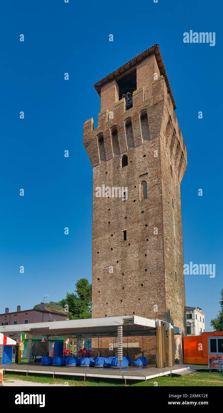 The medieval tower in Revere's sunny square. Revere is an ancient small town along the southern course of the Po River. Stock Photo