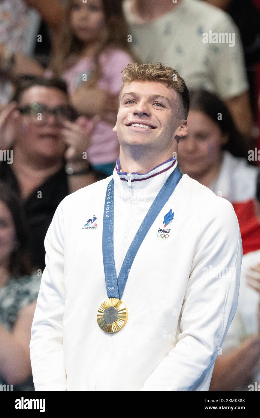 Paris France. 28th July 2024. Leon Marchand of Team France poses with his gold medal after winning the Men s 400m Individual Medley Final on day two of the Olympic Games Paris 2024