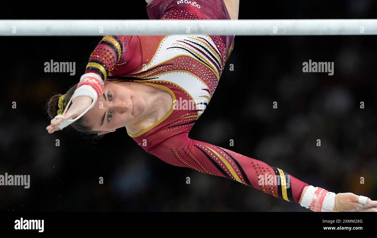 maellyse-brassart-of-belgium-competes-on-the-uneven-bars-during-a