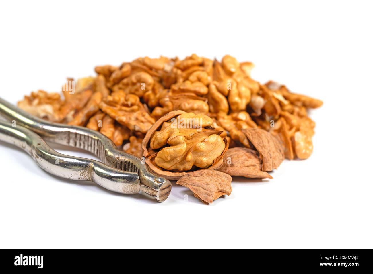 Cracked walnuts against a white background Stock Photo