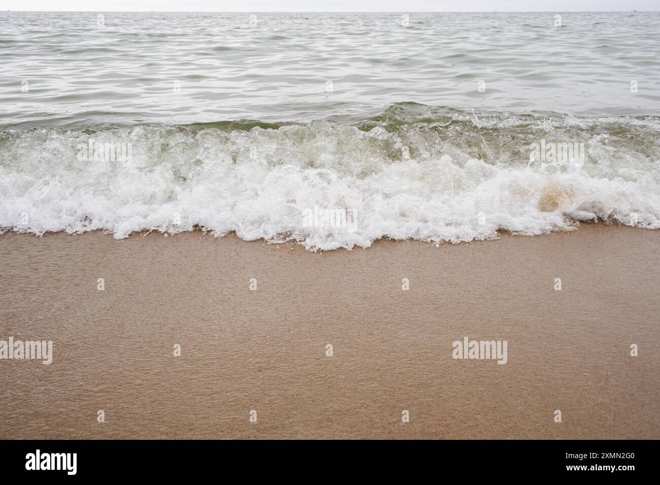 Beautiful waves on sandy beach hi-res stock photography and images - Alamy