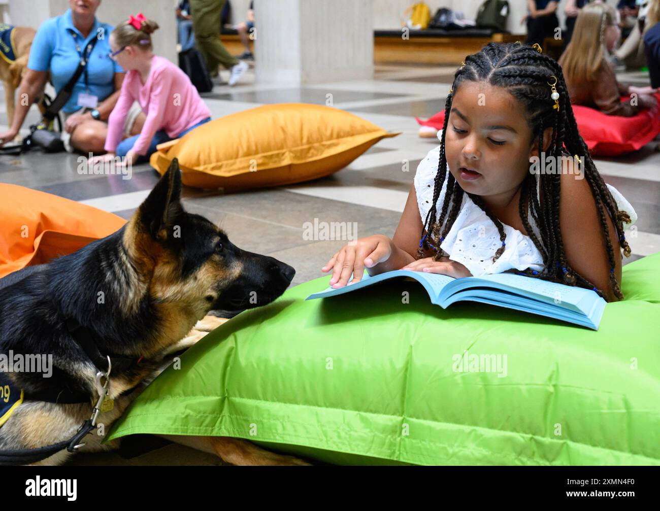 Read Shepherd EDITORIAL USE ONLY Paisley, aged seven, reads to German shepherd Sable ...