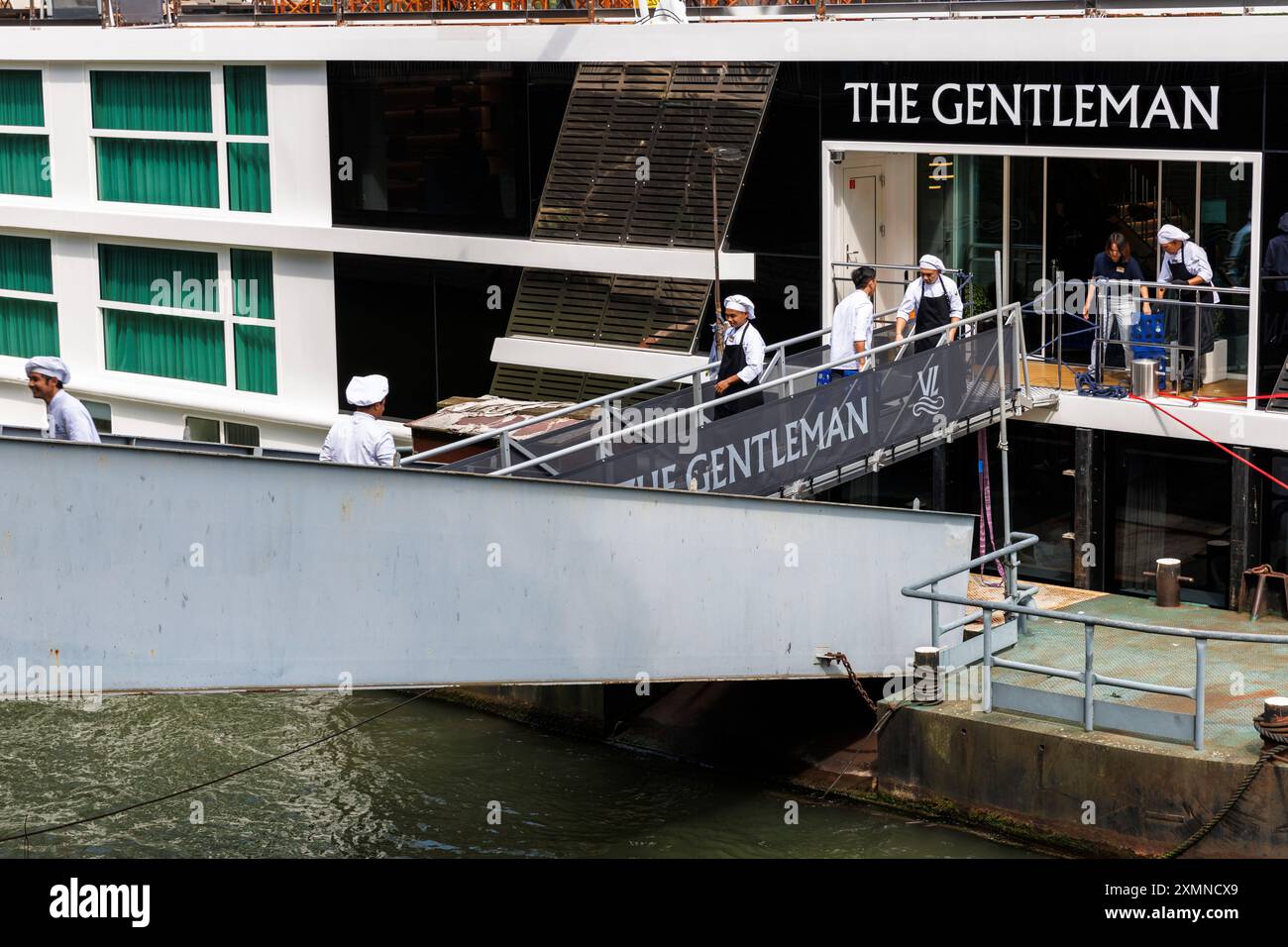 Chefs Of The Cruise Ship The Gentleman Carry Goods Over The Jetty On 