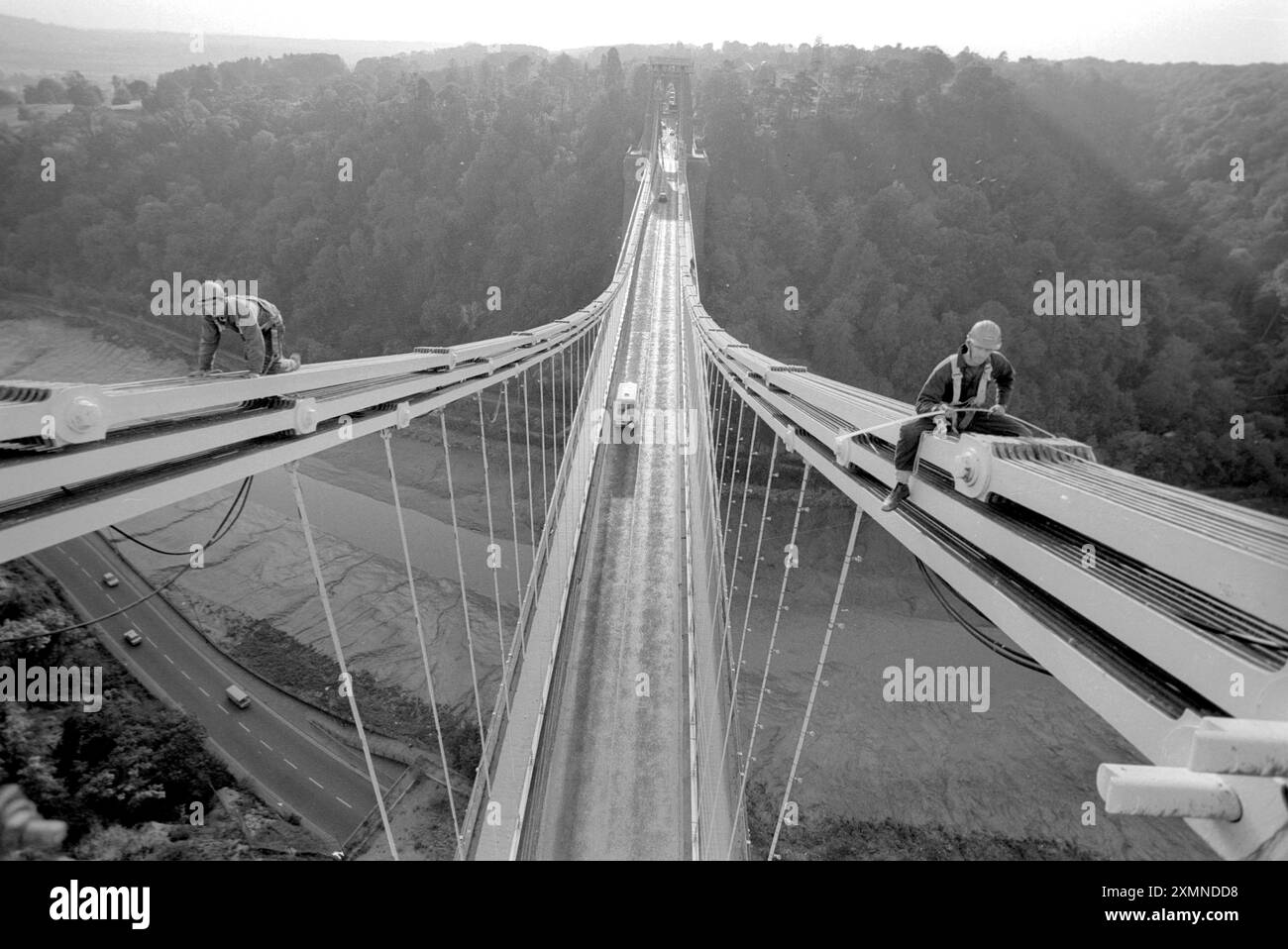 High tension workmen work on the chains of Clifton Suspension Bridge ...