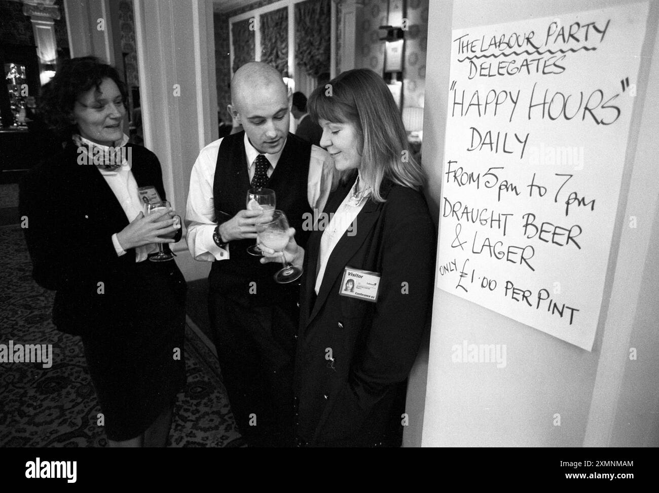 Sign advertising Happy Hour with visitors enjoying a drink at Labour Party Conference at Brighton    28 September 1993    Picture by Roger Bamber Stock Photo