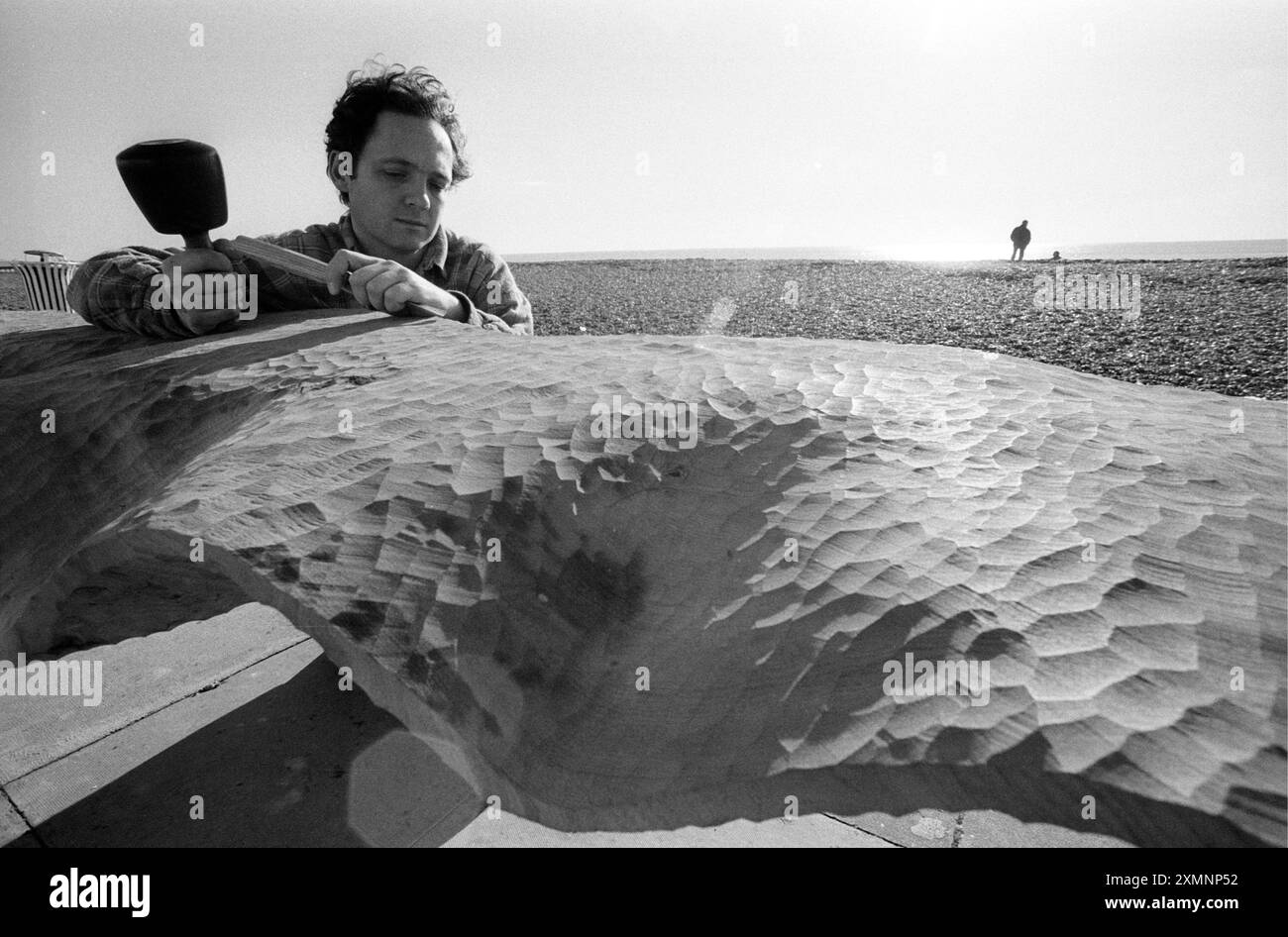 Artist Steve Geliot completing an elm and cast iron bench as part of a radical redesign of Brighton seafront in 1995.31 January 1995 Picture by Roger Bamber Stock Photo