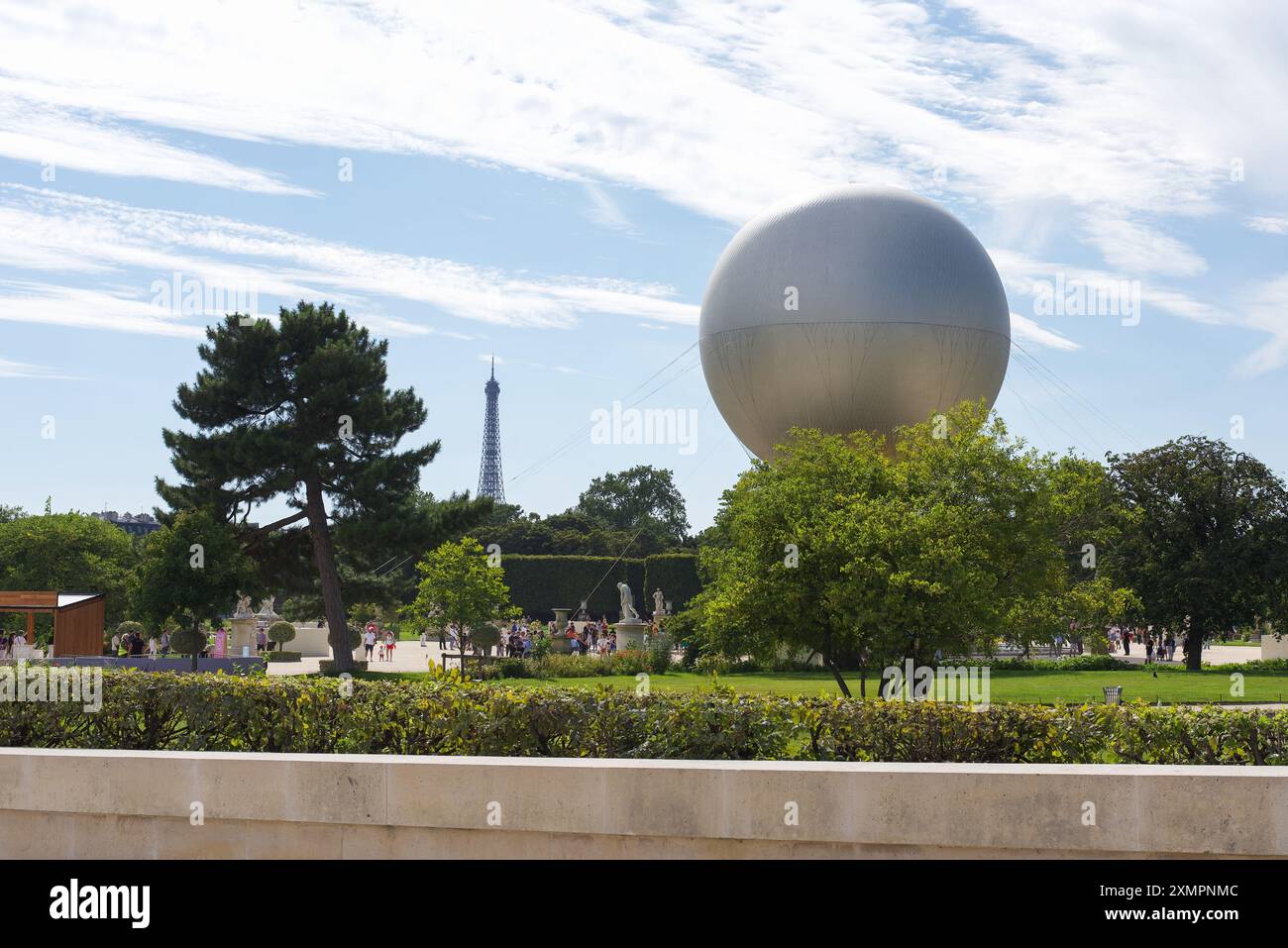 Paris, France, 07.28.2024 The Olympic cauldron in the Tuileries Garden with the Eiffel Tower in the background. Stock Photo