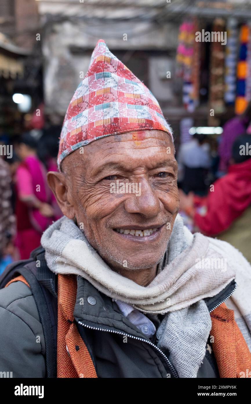 Nepalese gentleman wearing traditional dhaka topi cap or hat in streets ...