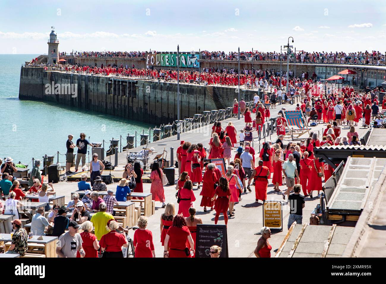 Dancers in red dresses arriving on Folkestone's Harbour Arm for Kate ...