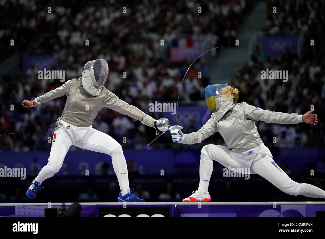 France's Sara Balzer, left, competes with Ukraine's Olga Kharlan in the ...