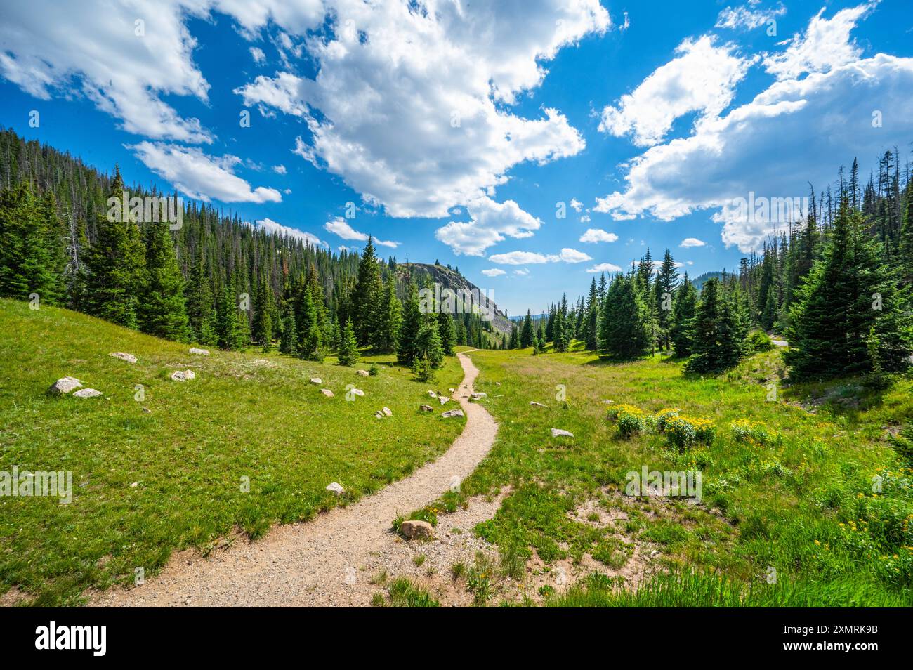 Rocky Mountain National Park cliff face and alpine trail with lakes and ...