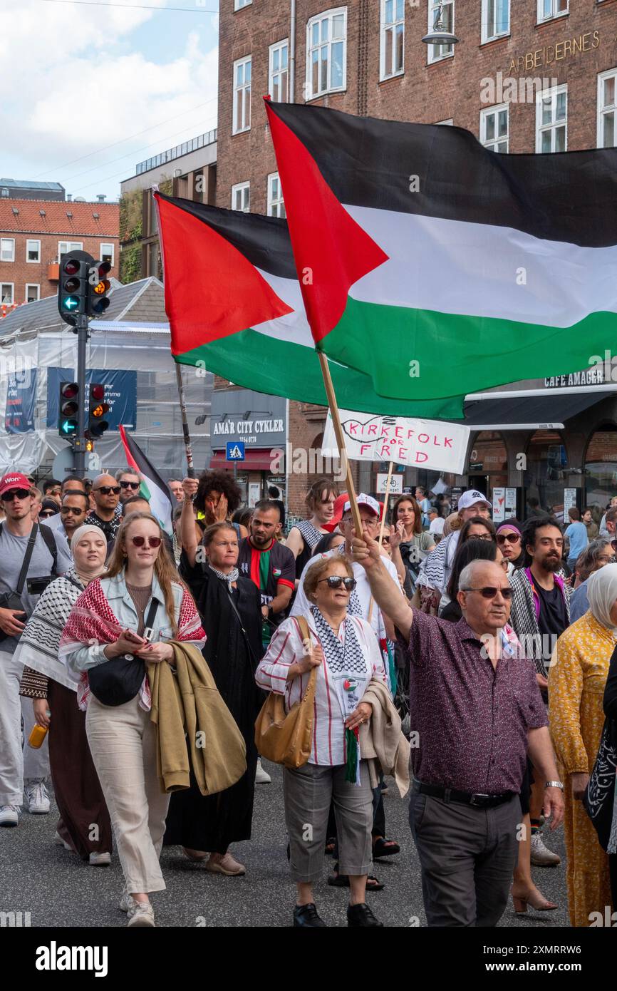 Crowd of people marching in demonstration in solidarity with Palestine Stock Photo