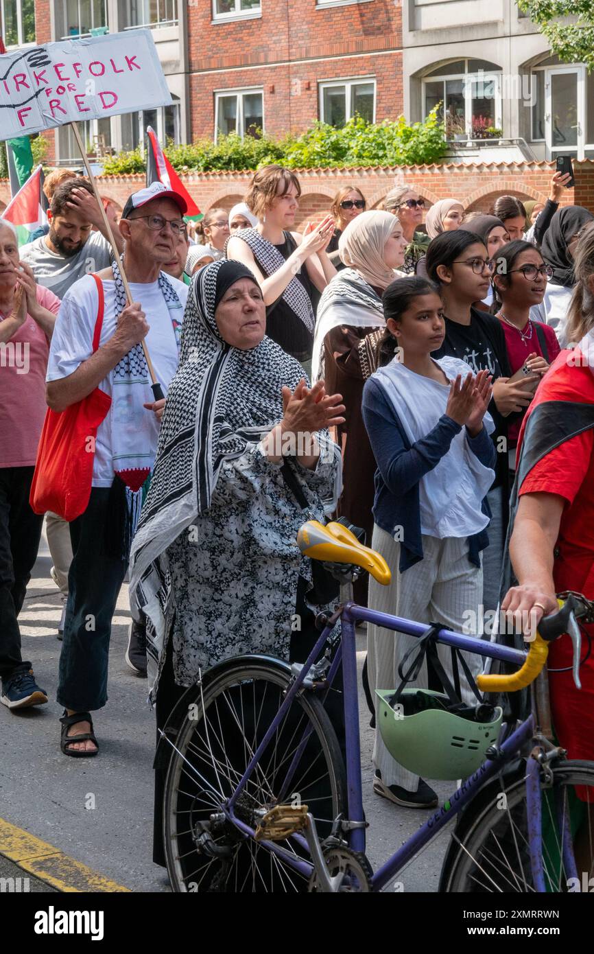 Crowd of people marching in demonstration in solidarity with Palestine Stock Photo