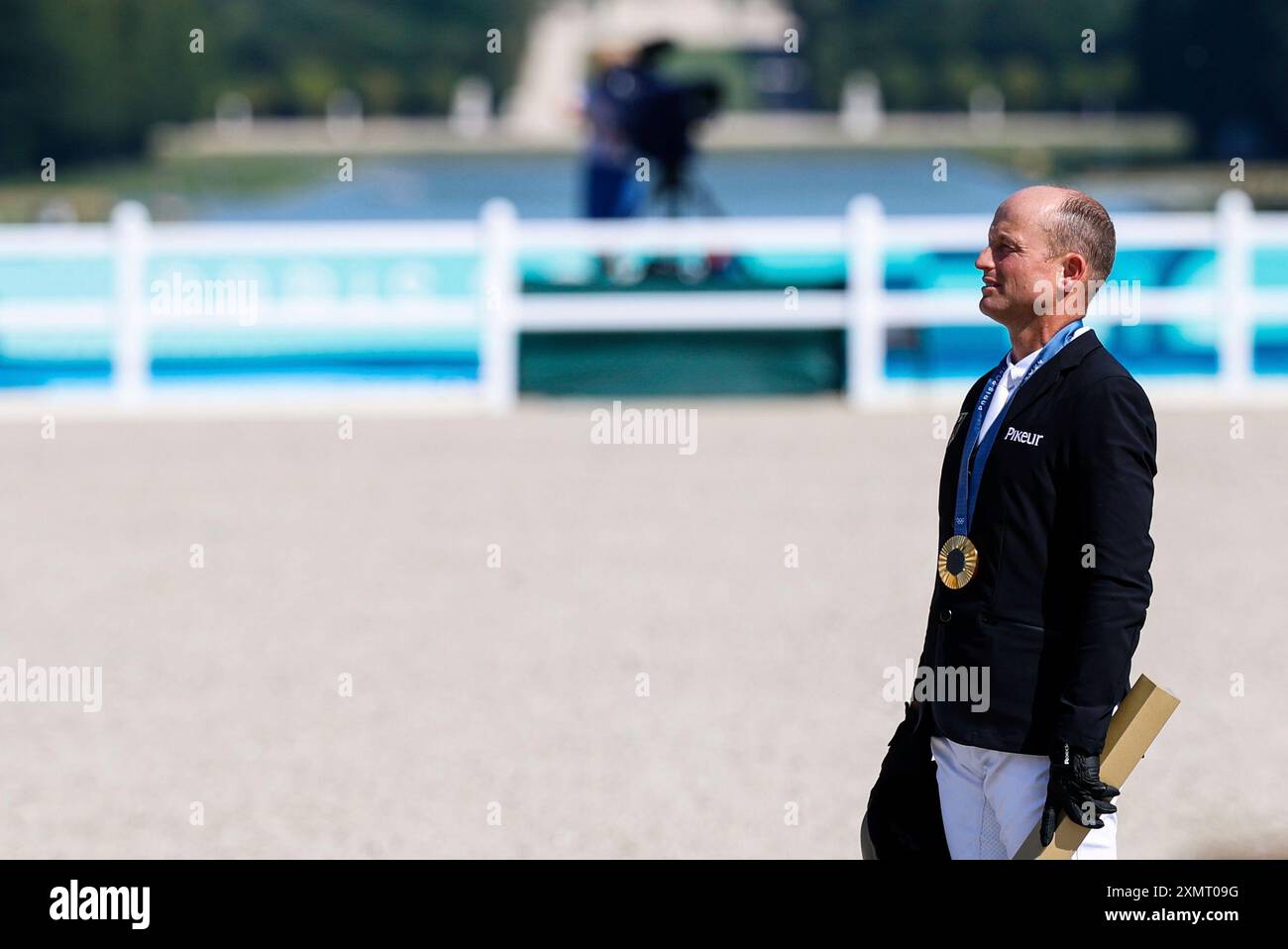 Michael Jung of Germany with the gold medal celebrates during the ...